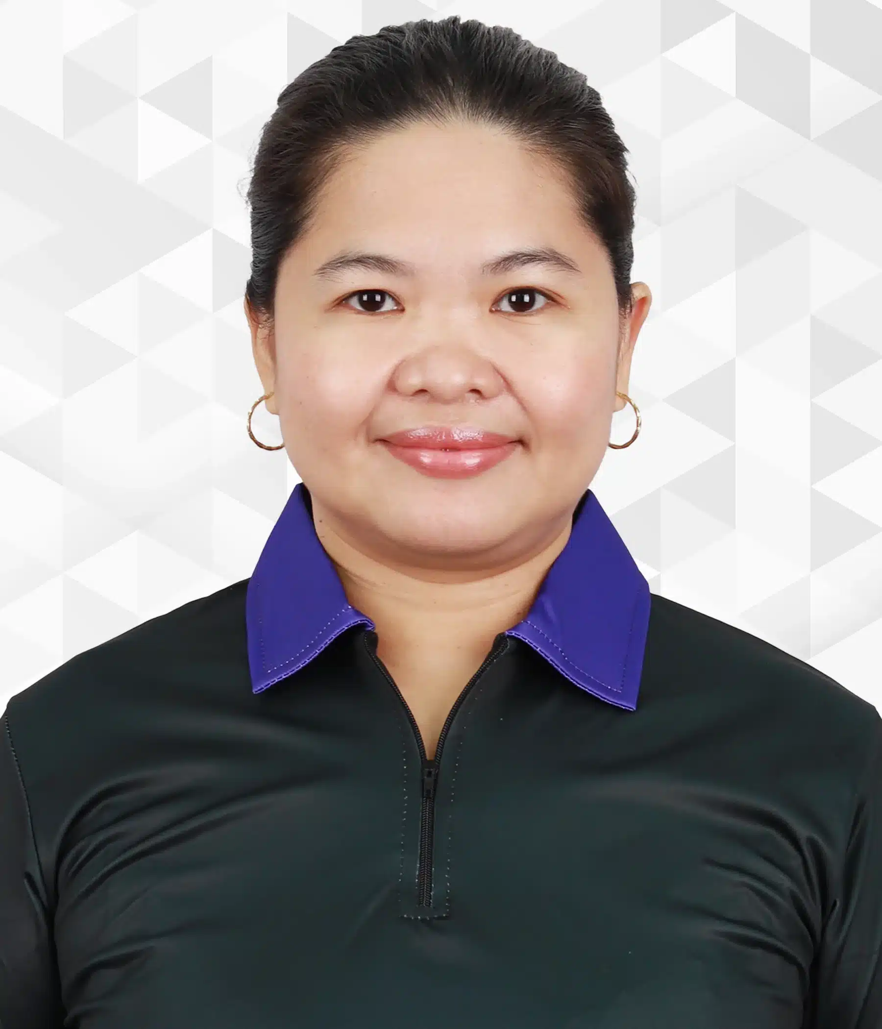 Erlene Aquino, Chief People Officer of Boomering, in a black shirt with a purple collar, smiling confidently.