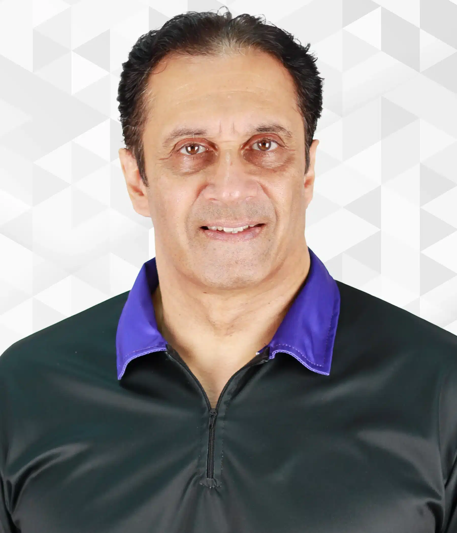 Rohan Fernando, COO of Boomering, dressed in a black shirt featuring a purple collar.