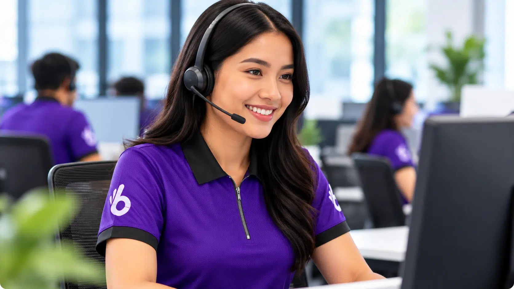 Australia 6 Boomering customer support professional wearing a headset while assisting clients from a modern office.